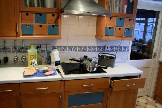 A kitchen with food and cleaning products
